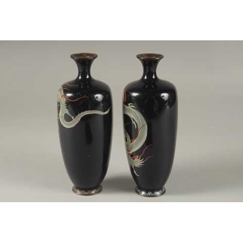 117 - A FINE PAIR OF JAPANESE MIDNIGHT BLUE GROUND CLOISONNNE ENAMELLED VASES, decorated with dragons, sig... 