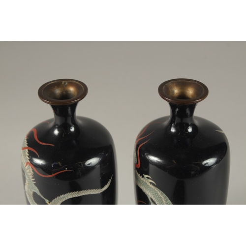 117 - A FINE PAIR OF JAPANESE MIDNIGHT BLUE GROUND CLOISONNNE ENAMELLED VASES, decorated with dragons, sig... 