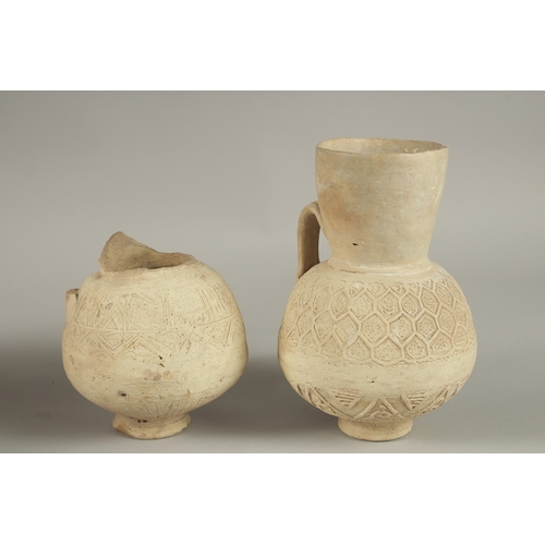 123 - TWO 12TH-13TH CENTURY SELJUK ANAATOLIAN UNGLAZED POTTERY JUGS, one signed, made by Rafi, largest 22c... 