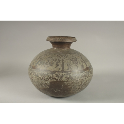 125 - A LARGE AND RARE 18TH CENTURY NORTH INDIAN RAJASTAN BRASS LOTA, engraved with dancers and mythical c... 