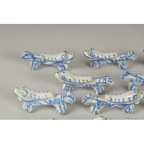 13 - A COLLECTION OF CHINESE BLUE AND WHITE PORCELAIN BRUSH RESTS / CHOPSTICK RESTS, (qty).