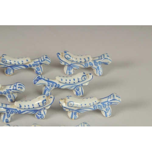 13 - A COLLECTION OF CHINESE BLUE AND WHITE PORCELAIN BRUSH RESTS / CHOPSTICK RESTS, (qty).