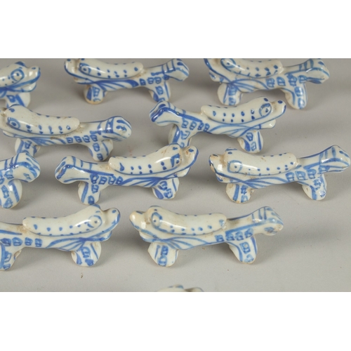 13 - A COLLECTION OF CHINESE BLUE AND WHITE PORCELAIN BRUSH RESTS / CHOPSTICK RESTS, (qty).