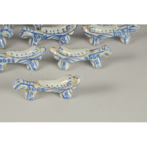 13 - A COLLECTION OF CHINESE BLUE AND WHITE PORCELAIN BRUSH RESTS / CHOPSTICK RESTS, (qty).