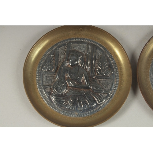 133 - A PAIR OF 19TH CENTURY INDIAN TANJORE SILVER MOUNTED BRASS DISHES, 8.5cm diameter each.