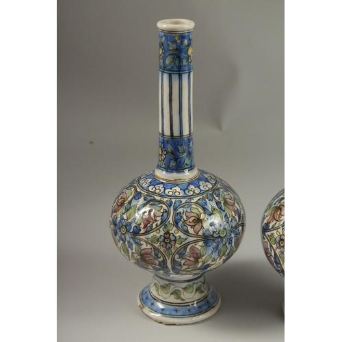 135 - A FINE PAIR OF 19TH CENTURY PERSIAN QAJAR GLAZED POTTERY BOTTLE VASES, 32cm high.