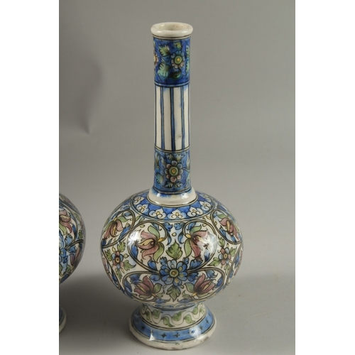 135 - A FINE PAIR OF 19TH CENTURY PERSIAN QAJAR GLAZED POTTERY BOTTLE VASES, 32cm high.