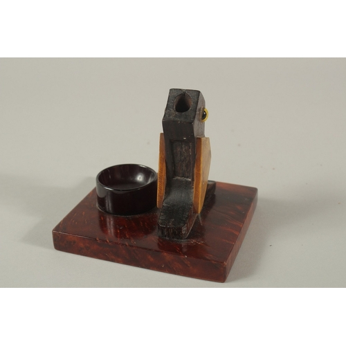 155 - AN EARLY 20TH CENTURY ART DECO DUNHILL STYLE BIRD-SHAPED MATCH HOLDER, with bakelite or cherry amber... 