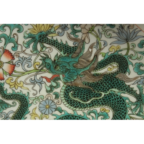 17 - A CHINESE FAMILLE VERTE PORCELAIN DRAGON DISH, base with character mark, 28cm diameter.