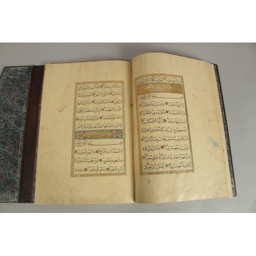 173 - A FINE 17TH CENTURY OTTOMAN LEATHER BOUND QURAN JUZ SECTION, with beautifully gilded illuminated sur... 