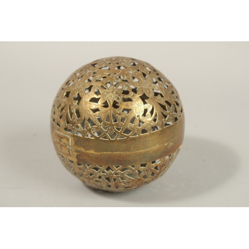 188 - A FINE EARLY 19TH CENTURY MUGHAL NORTH INDIAN OPENWORKED BRASS HAND WARMER, with birds and flower de... 