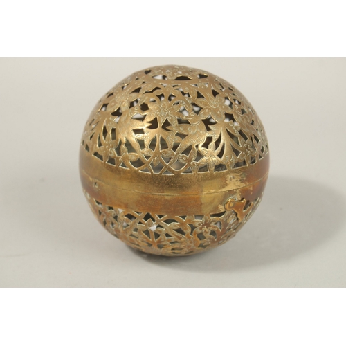 188 - A FINE EARLY 19TH CENTURY MUGHAL NORTH INDIAN OPENWORKED BRASS HAND WARMER, with birds and flower de... 