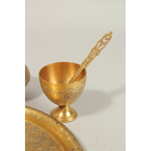 189 - A FINE 19TH-20TH CENTURY OTTOMAN TURKISH GILT COPPER TOMBAK COFFEE SET, tray 21cm diameter.