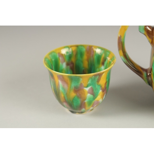 19 - A CHINESE YELLOW GREEN AND BROWN GLAZED PORCELAIN TEAPOT WITH TWO TEACUPS, each with character mark ... 