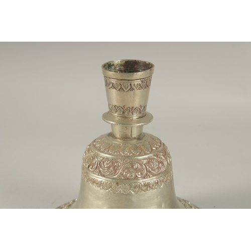 201 - A 19TH CENTURY INDIAN SILVER HUQQA BASE, with bands of embossed and chased foliate decoration, 19cm ... 