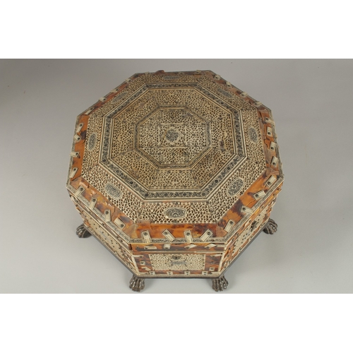 202 - A 19TH CENTURY ANGLO INDIAN TORTOISESHELL, BONE AND PENWORK OCTAGONAL SEWING BOX, 33cm at widest poi... 