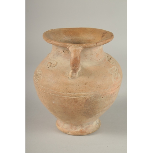 203 - A 10TH CENTURY MIDDLE EASTERN ISLAMIC UNGLAZED POTTERY JUG, with carved calligraphy and animals, 18.... 