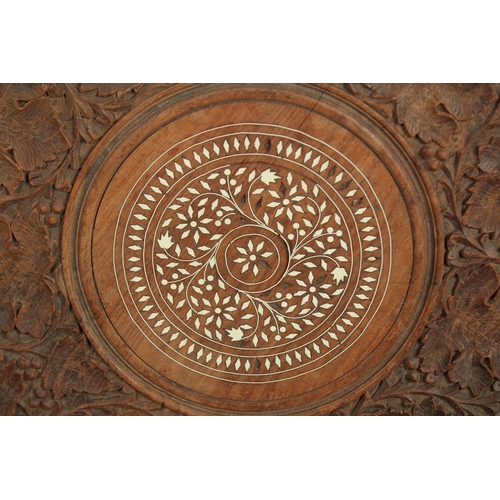 205 - A FINELY CARVED ANGLO INDIAN BONE INLAID CIRCULAR WOODEN TABLE TOP, carved with foliate designs, 58c... 