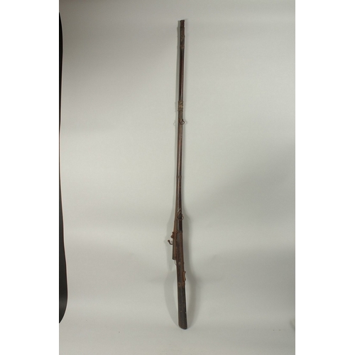 219 - AN 18TH CENTURY MUGHAL INDIAN MATCHLOCK RIFLE, with gold inlaid barrel and trigger.