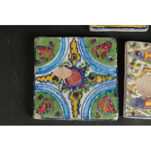 227 - A COLLECTION OF THREE PERSIAN QAJAR TILES, including one with fish designs, largest 13cm square, (3)... 