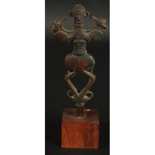 234 - A RARE ANCIENT PERSIAN LURISTAN BRONZE IDOL, mounted to wooden base, bronze 12.5cm.