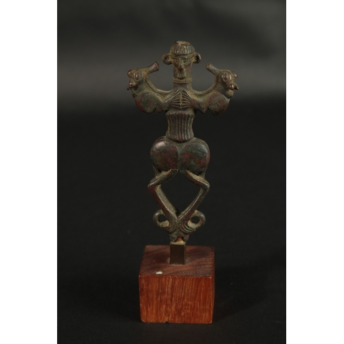 234 - A RARE ANCIENT PERSIAN LURISTAN BRONZE IDOL, mounted to wooden base, bronze 12.5cm.