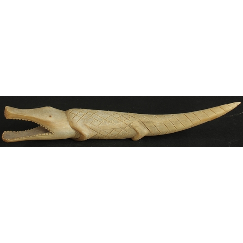 237 - AN EARLY 20TH CENTURY CARVED HORN CROCODILE, 31cm long.