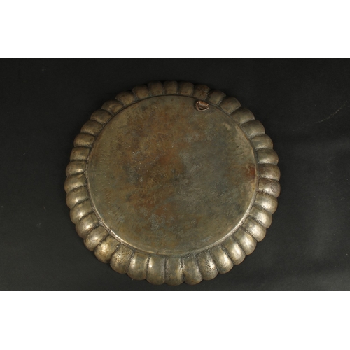 241 - A FINE 18TH CENTURY MUGHAL INDIAN TINNED BRASS CHARGER, signed to the reverse, 34cm wide.