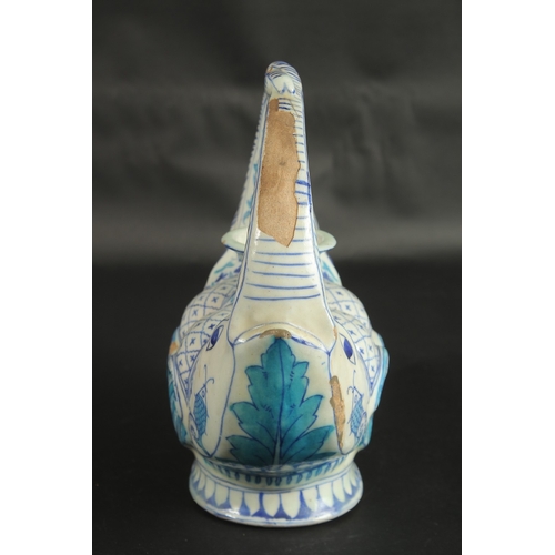 243 - AN UNUSUAL 19TH CENTURY INDIAN MULTAN ZOOMORPHIC GLAZED POTTERY EWER, 27cm high.