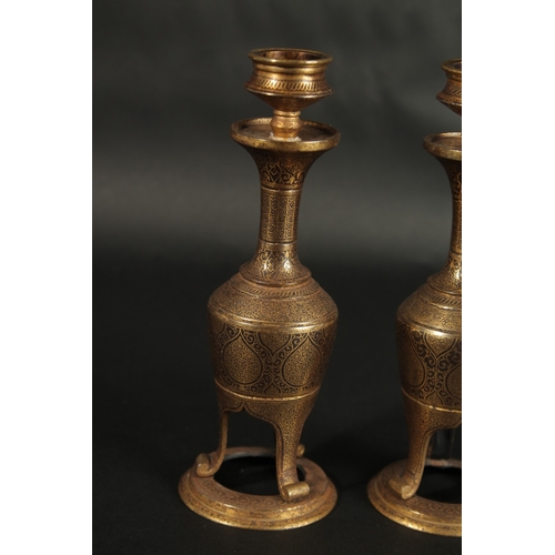 244 - A VERY FINE PAIR OF 19TH CENTURY  NORTH INDIAN GOLD INLAID STEEL CANDLESTICKS, 18.5cm high.