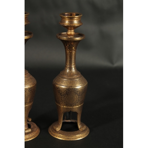 244 - A VERY FINE PAIR OF 19TH CENTURY  NORTH INDIAN GOLD INLAID STEEL CANDLESTICKS, 18.5cm high.