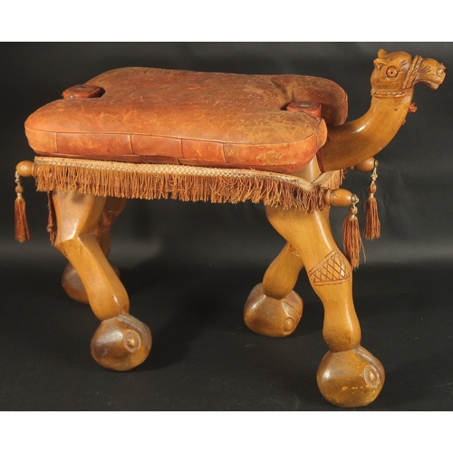 249 - A MID 20TH CENTURY CARVED WOOD CAMEL SEAT, with leather top.