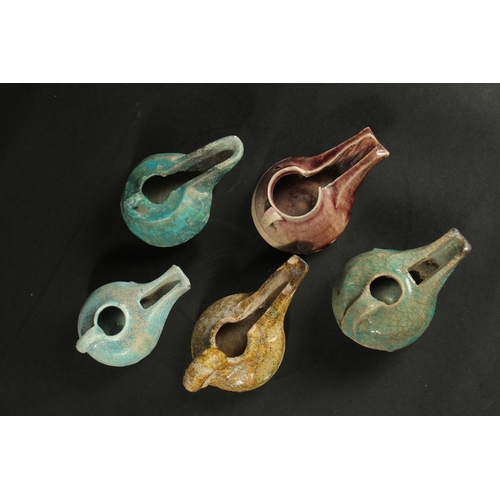 251 - A COLLECTION OF FIVE 12TH-13TH CENTURY PERSIAN GLAZED POTTERY OIL LAMPS, (5).