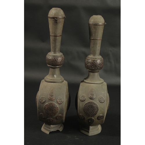 252 - A RARE PAIR OF 18TH CENTURY PERSIAN COPPER MOUNTED LEAD BOTTLES, with openworked panels, 37cm high.