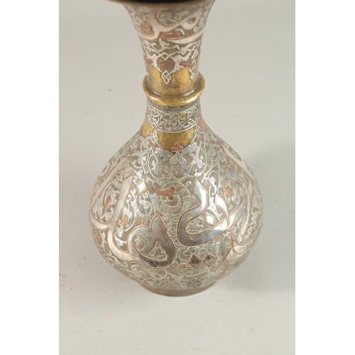 253 - A FINE 19TH CENTURY SYRIAN SILVER AND COPPER INLAID BRASS VASE, with large bands of calligraphy, 36c... 