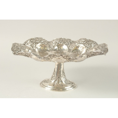 254 - A PERSIAN ENGRAVED AND CHASED SOLID SILVER FOOTED CENTREPIECE, with detachable stand, the bowl engra... 