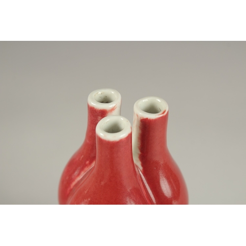 26 - A CHINESE IRON RED GLAZE TULIP VASE, the base with character mark, 20cm high.