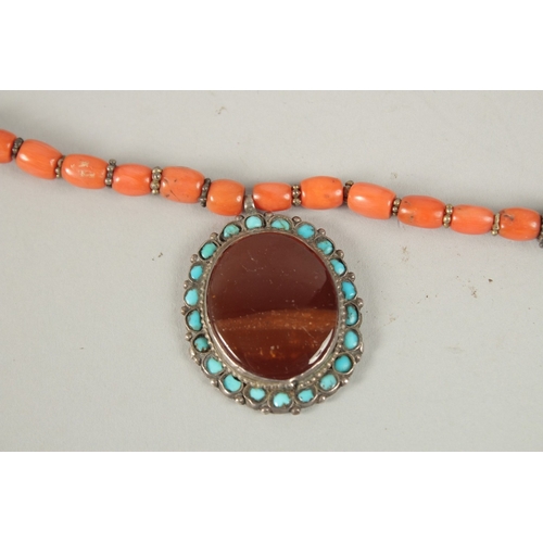 260 - A VERY FINE BUKHARA CORAL BEADED SILVER NECKLACE WITH AGATE PENDANT, adorned with turquoise beads, p... 