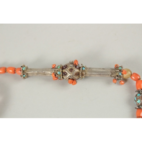 260 - A VERY FINE BUKHARA CORAL BEADED SILVER NECKLACE WITH AGATE PENDANT, adorned with turquoise beads, p... 