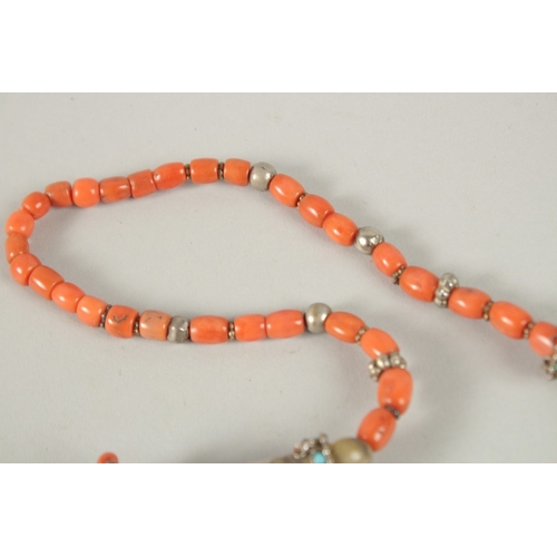 260 - A VERY FINE BUKHARA CORAL BEADED SILVER NECKLACE WITH AGATE PENDANT, adorned with turquoise beads, p... 