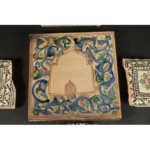 264 - A PERSIAN QAJAR GLAZED POTTERY TILE AND CORNER TILE (in three pieces), together with another glazed ... 