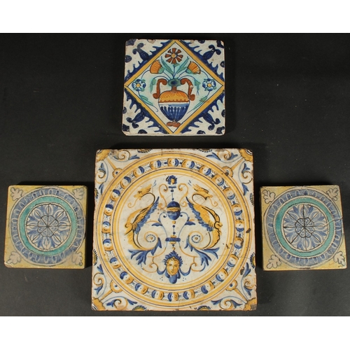 265 - A COLLECTION OF FOUR ITALIAN / EUROPEAN GLAZED POTTERY TILES, largest 20cm square.