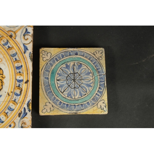 265 - A COLLECTION OF FOUR ITALIAN / EUROPEAN GLAZED POTTERY TILES, largest 20cm square.