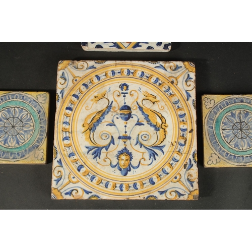 265 - A COLLECTION OF FOUR ITALIAN / EUROPEAN GLAZED POTTERY TILES, largest 20cm square.