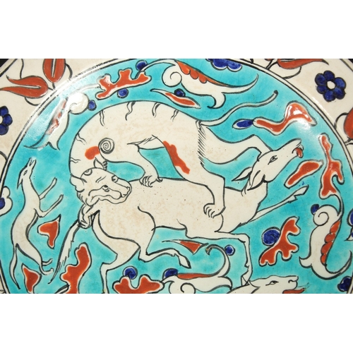 267 - AN EARLY 20TH CENTURY BOCH FRERES KERAMIS IZNIK STYLE GLAZED POTTERY PLATE, painted with animals and... 