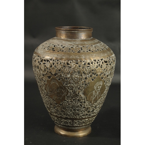 269 - A LARGE ISLAMIC PERSIAN OPENWORKED BRASS VASE, engraved with portraits and animals, 30cm high.