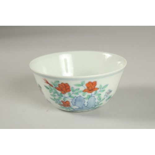 27 - A FINE CHINESE DOUCAI PORCELAIN CHICKEN CUP, the base with character mark, 8.5cm diameter.