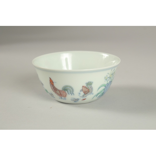 27 - A FINE CHINESE DOUCAI PORCELAIN CHICKEN CUP, the base with character mark, 8.5cm diameter.