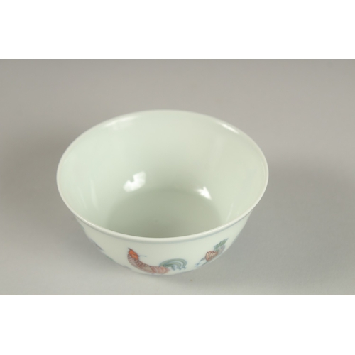 27 - A FINE CHINESE DOUCAI PORCELAIN CHICKEN CUP, the base with character mark, 8.5cm diameter.