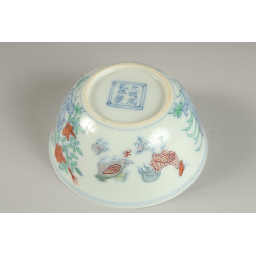 27 - A FINE CHINESE DOUCAI PORCELAIN CHICKEN CUP, the base with character mark, 8.5cm diameter.